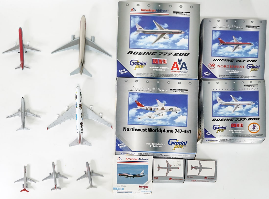 A Group of Small Diecast Desk Models: A Group of Small Diecast Desk Models. One is missing front landing gear (smallest American Airlines airplane). lot is absent of a condition report one may be requested via email. Condition report is p