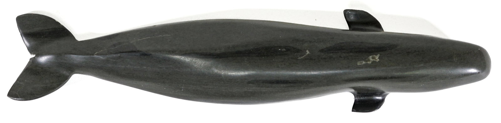 Canada Inuit First Nation Signed Soapstone Whale: Canada Inuit First Nation Signed Soapstone Whale Sculpture. Signed, measures 12 inches length. There are a few tiny chips on the back left tail fin. There is some veining on the back (this is not a cr