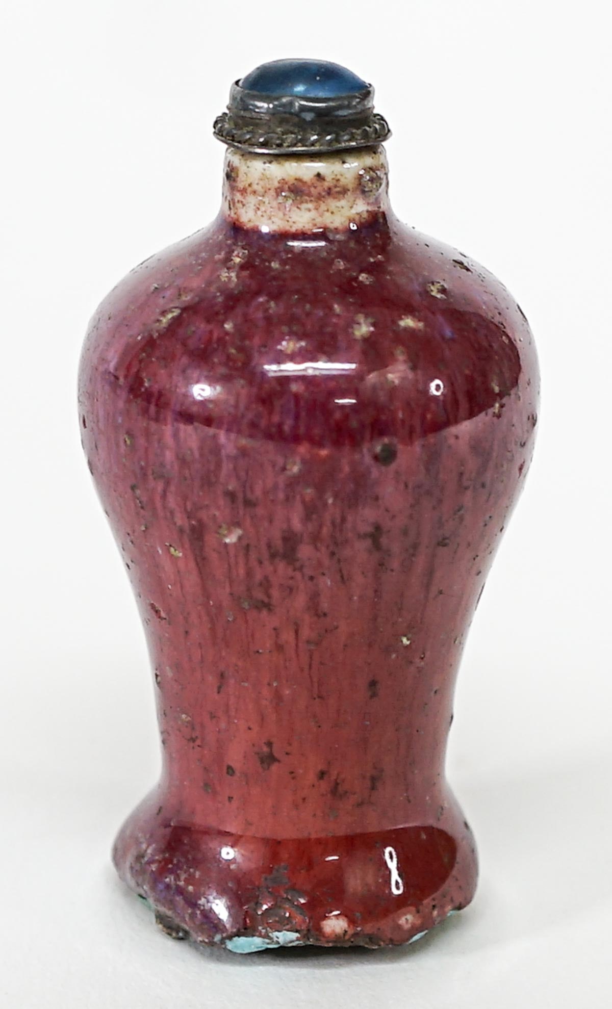Antique Chinese Snuff Bottle: Antique Chinese snuff bottle is purple with a blue jewel lid and measures 2.75 in. tall. The absence of a condition report does not imply that the lot is in perfect condition or completely free from w