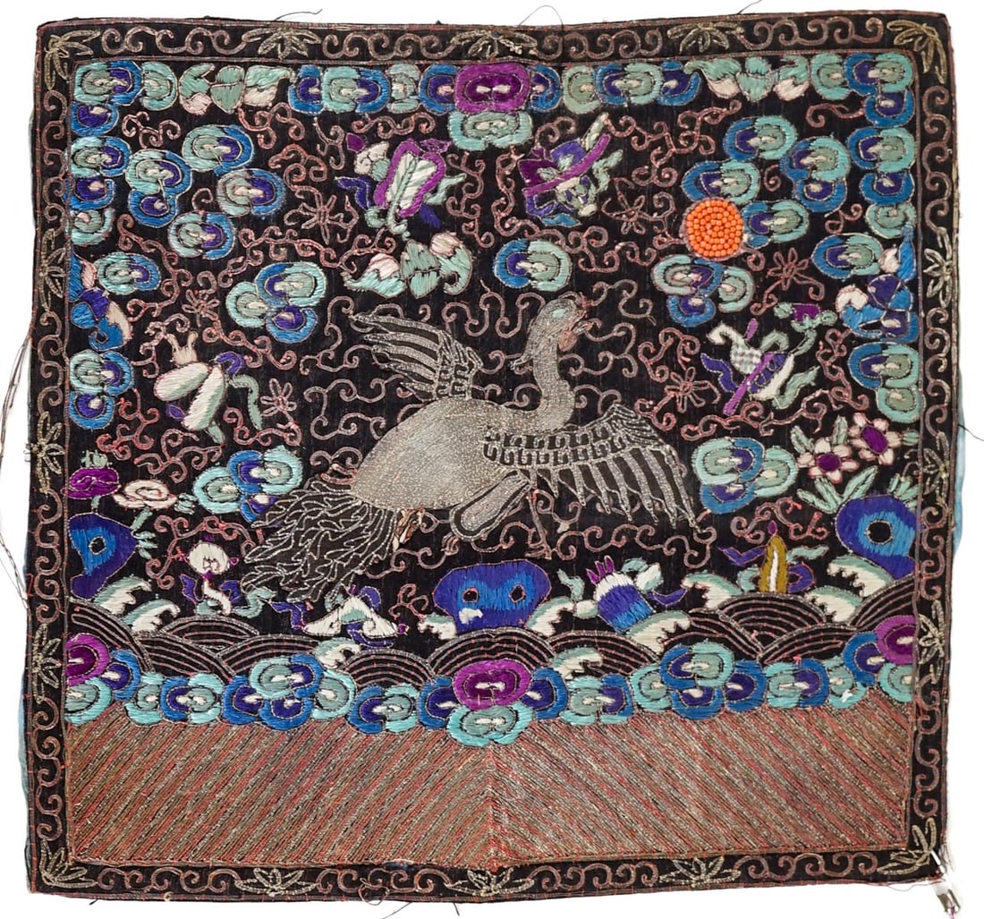 Embroidered Chinese Rank Badge [Silver Pheasant]: Embroidered with coral beads upper right. Fabric on back separated. Measures 10.5 in. x 11.5 in. The absence of a condition report does not imply that the lot is in perfect condition or completely fre