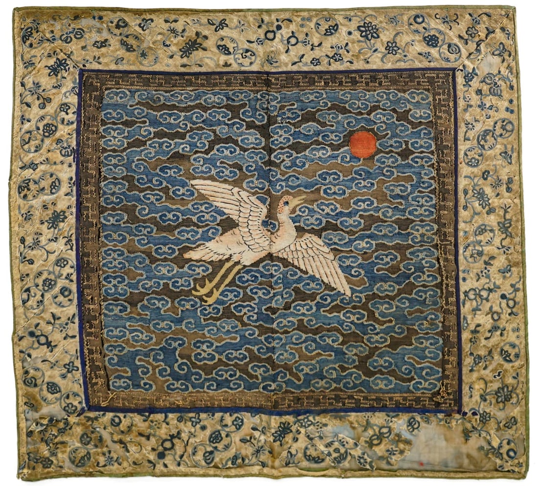 Embroidered Chinese Rank Badge [Bird]: The badge measures 11.25 in. x 11.75 in. and is attached to a floral boarder that measures 2 in. Badge is torn at seams and center. The boarder with fabric loss. The absence of a condition report does