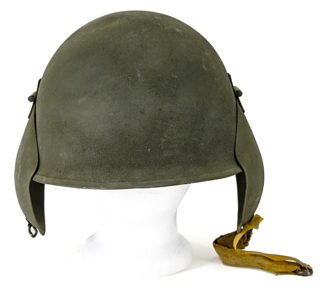 Vintage Military Helmet: Military helmet. Lot measures 9 in. H x 10 in. W x 10 in. D. The absence of a condition report does not imply that the lot is in perfect condition or completely free from wear and tear, imperfections,