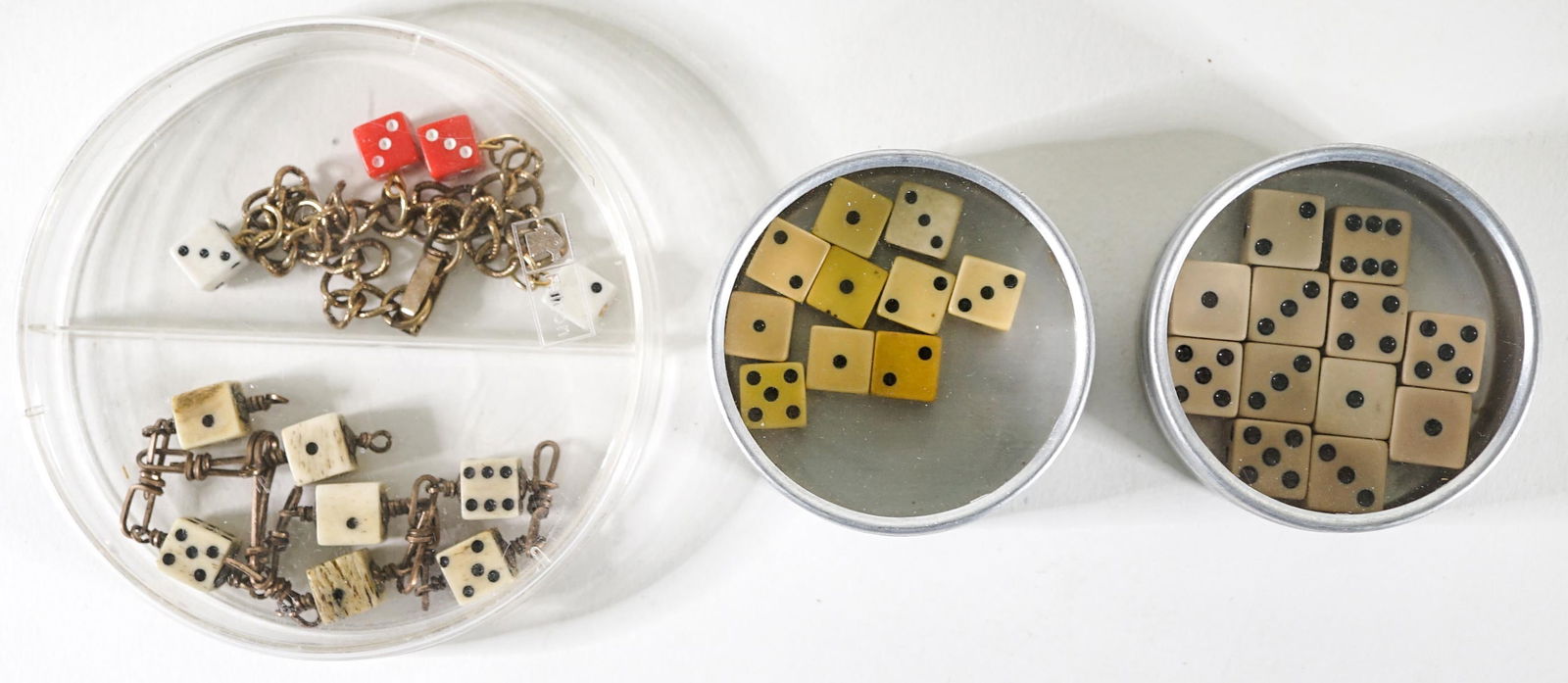 Antique Bone Dice Bracelet, Bakelite Dice etc.: Antique Bone Dice Bracelet, Bakelite Dice (small and miniature) etc. Not all items in this lot are bone, Bakelite or Catalin. The group measures 2.75 x 3.75 x 3.75 inches. Due to the volume of this es