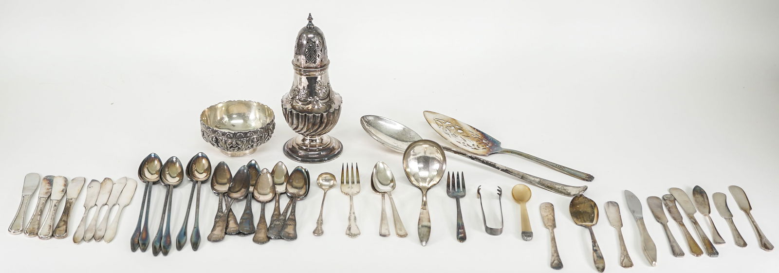 Assorted Vintage Silverplate Serveware: Assorted vintage silverplate serveware pieces. Lot of silverplate measures 13.25 in. H x 8 in. W x 4 in. D for shipping purposes only. The absence of a condition report does not imply that the lot is