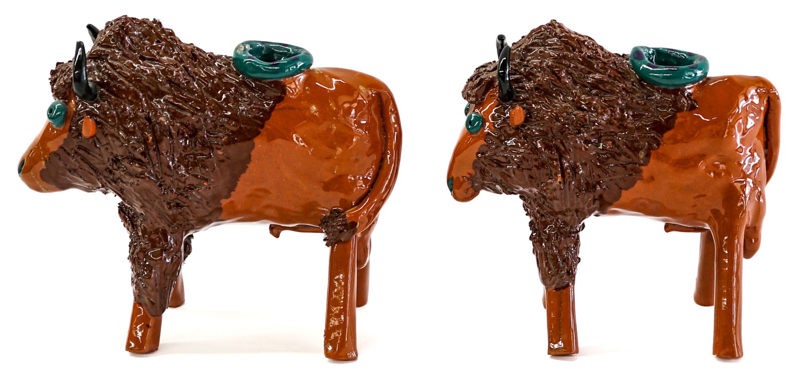Betsey Hurd (Pair) Pottery Buffalo Candleholders: Betsey Hurd (2) pottery candleholders. Each measures 6 in. H x 6.75 in. Long x 6.25 in. W. Signed 'Hurd' underside. No evident cracks or repairs. Provenance: Estate of Maureen "Mo" Gary (Lolo, Montana