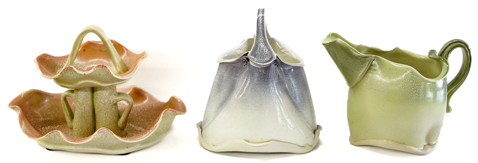 Martha Grover (3) Ceramic Signed Pieces: Three (3) Martha Grover signed ceramic pieces include: 6.25 in. tall pitcher; 7.5 in. tall handled basket (note jointed at handle possible repair); 6.5 in. tall 2 tier serveware. Provenance: Estate of