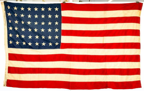 48 Star US Flag: Measures 42 x 69 inches. Very good condition. The absence of a condition report does not imply that the lot is in perfect condition or completely free from wear and tear, imperfections, or the conditi