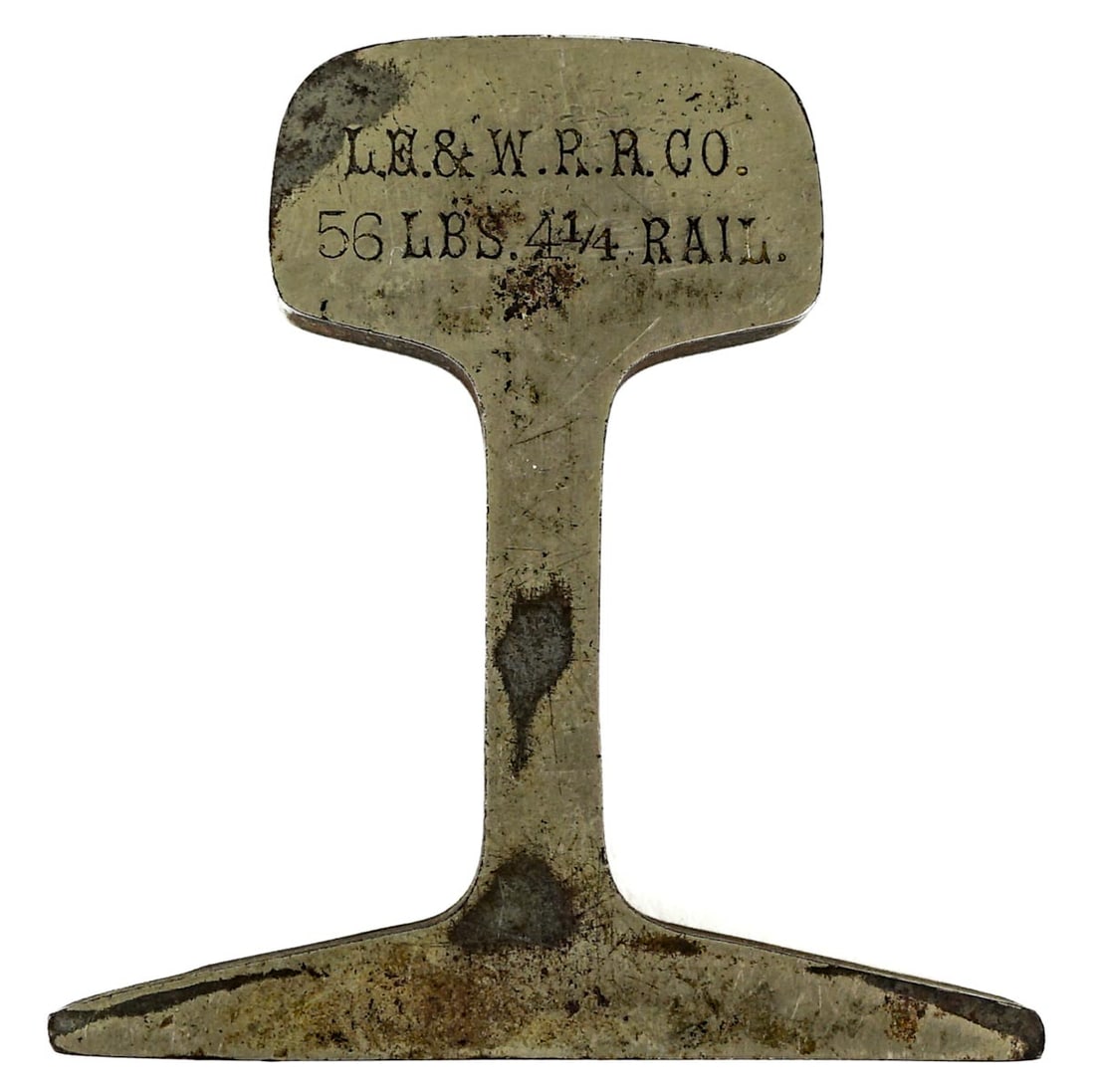 Lake Erie and Western Railroad Piece of Track: [Artifact, Paperweight, Railroadiana] Lake Erie and Western Railroad Piece of Track. Measures 4.25 x 4.25 x .625 inches. The absence of a condition report does not imply that the lot is in perfect con