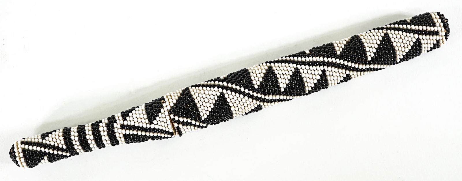 Vintage Beaded 11IN Dagger [Black and White]: Geometric black and white beaded dagger. Measures 11.25 in. long. Lot measures 11.25 in. H x 1 in. W x .75 in. D for shipping purposes only. The absence of a condition report does not imply that the l