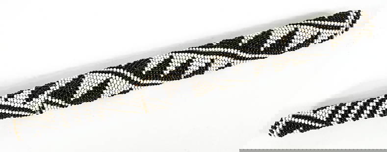 Vintage Beaded 11IN Dagger [Black and White]: Geometric black and white beaded dagger. Measures 11.25 in. long. Lot measures 11.25 in. H x 1 in. W x .75 in. D for shipping purposes only. The absence of a condition report does not imply that the l