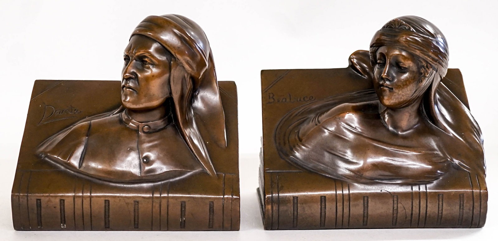 Dante & Beatrice Jennings Brothers Clad Bookends: Each measures 5.75 x 5.75 x 4 inches. No damage. The absence of a condition report does not imply that the lot is in perfect condition or completely free from wear and tear, imperfections, or the cond