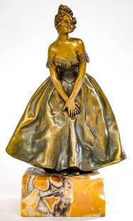 An Antique Bronze. Woman in Dress [Foundry Mark]: Measures 6 x 4.75 x 3.5 inches, stands atop a bronze base and measures 7.375 inches tall total. No damage. The absence of a condition report does not imply that the lot is in perfect condition or