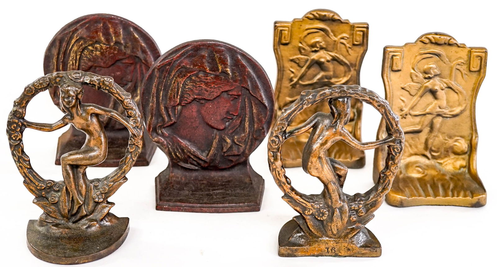 Three Pairs Art Noveau Bookends: The round cast iron bookends with woman's head measures 6.25 x 5.25 x 2.5 inches, the round cast iron bookends with nude dancing lady measures 6 x 4.5 x 2.5 inches and the cast iron nude woman with sc