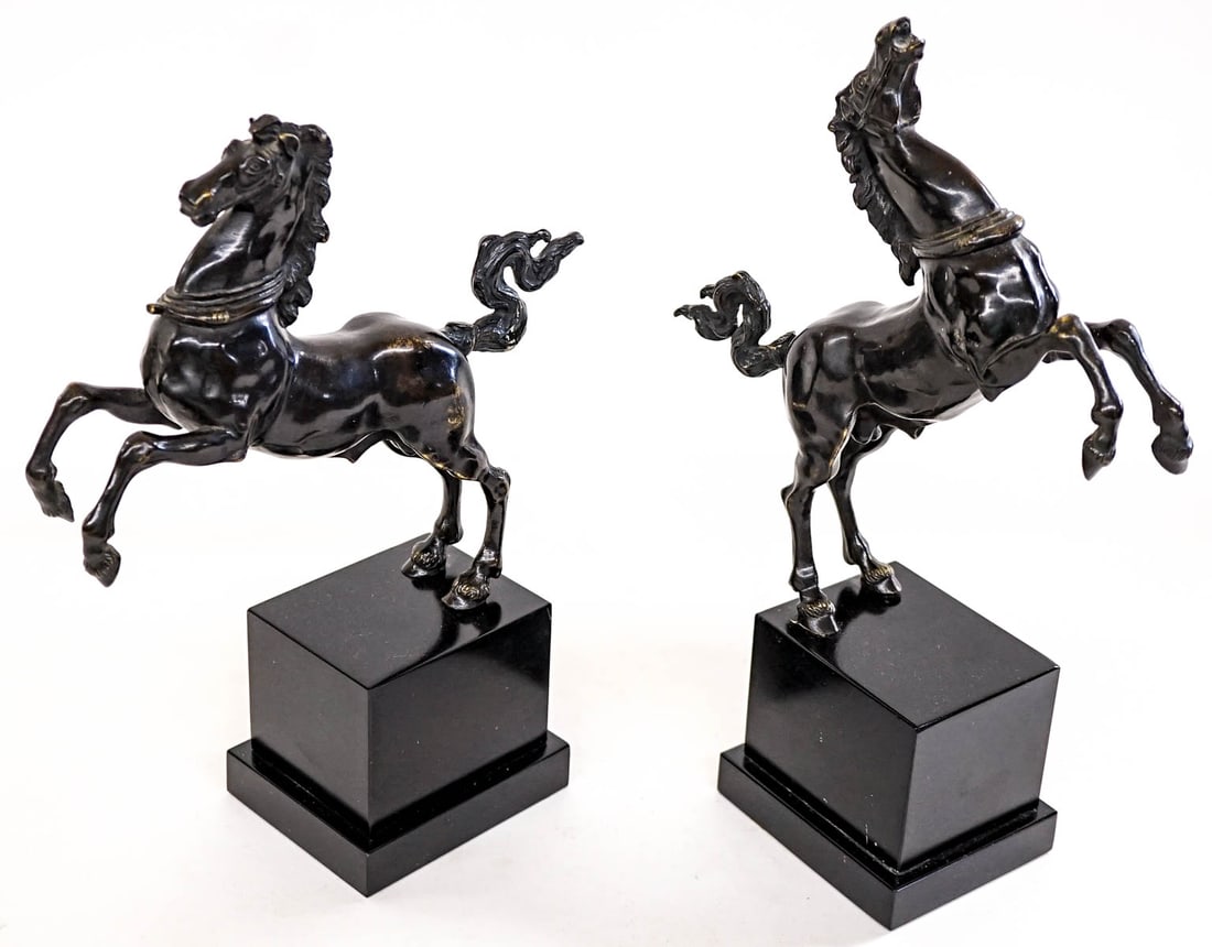 After Jean De Boulogne Pair of Tall Bookends: A pair of Italian patinated bronze model of a rearing horse, after the model by Jean De Boulogne [Giambologna] (Flemish, 1529 ? 1608), 20th century. Each measures 11 x 3.5 x 8.5 inches. No damage. The