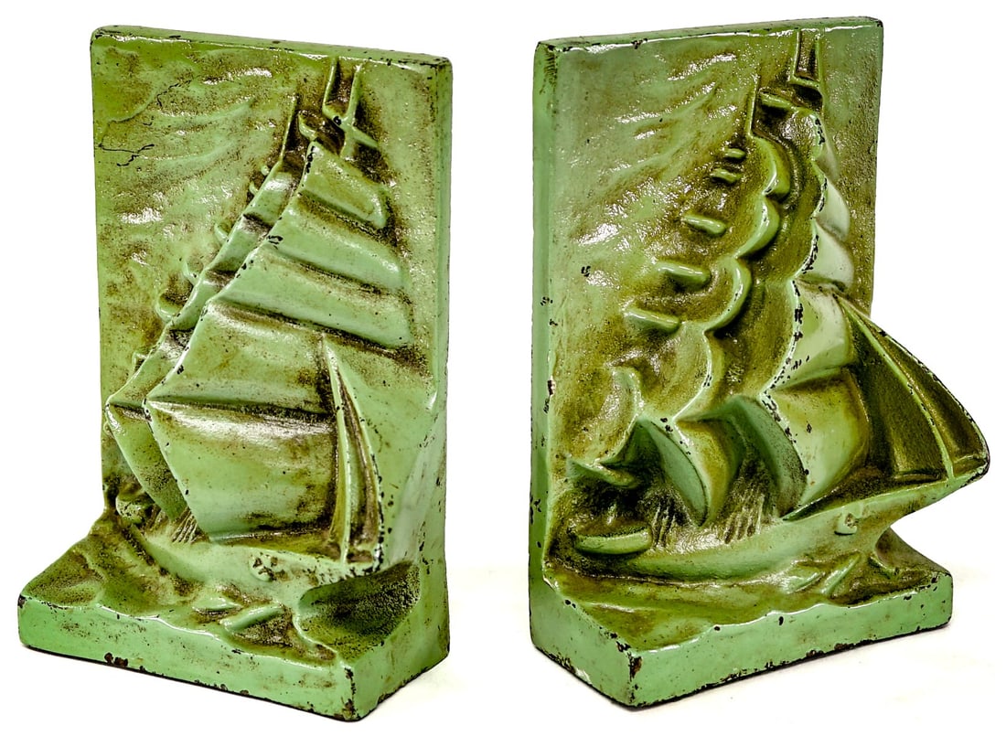 Cast Iron, Cold Painted Pair Bookends [Ship]: Each bookend measures 7 x 4.5 x 2 inches. Paint loss. The absence of a condition report does not imply that the lot is in perfect condition or completely free from wear and tear, imperfections, or the