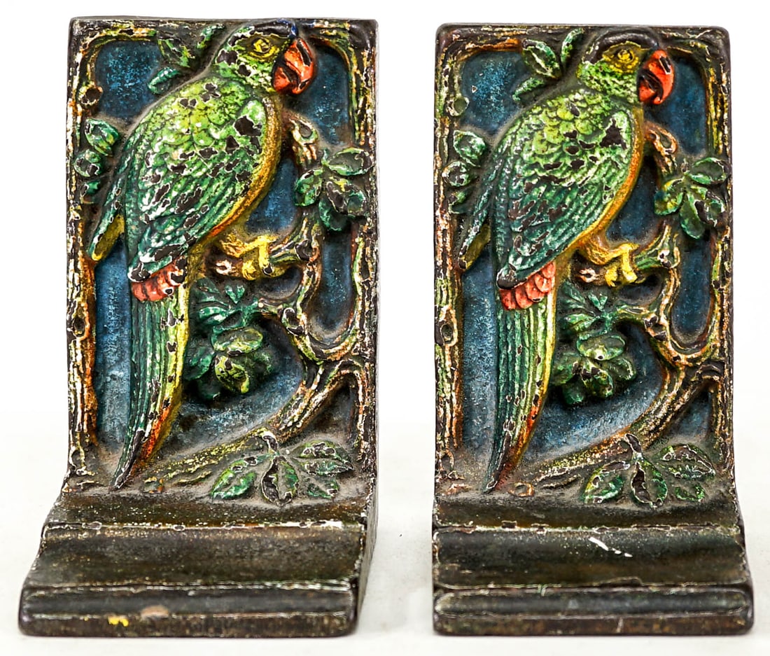 Hubley Cast Iron Pair Bookends [Parrot]: Each bookend measures 5 x 2.875 x 2.875 inches. Wear to paint. The absence of a condition report does not imply that the lot is in perfect condition or completely free from wear and tear, imperfection