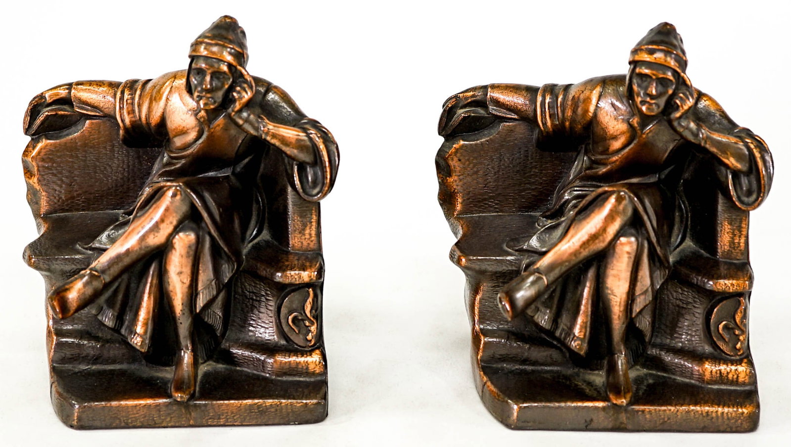 Metal Pair Bookends, Hollow-Cast Filled [Man]: Man seated pair bookends. Each bookend measures 6.25 x 7 x 3.5 inches. No damage. The absence of a condition report does not imply that the lot is in perfect condition or completely free from wear and