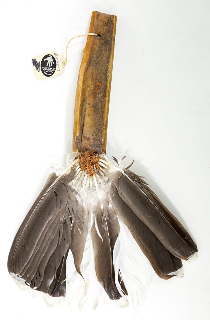 Jack Elook SIGNED Alaskan Hand Fan: Alaskan hand fan with mastodon handle signed 'J. Elook' measures 11 in. x 7 in. Lot measures 11 in. H x 7 in. W x .75 in. D for shipping purposes only. The absence of a condition report does not imply
