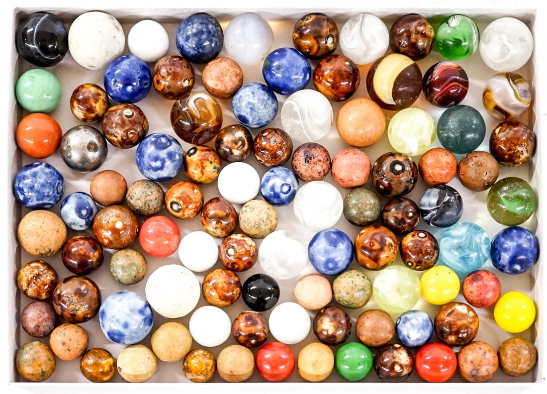 A Group of Antique & Vintage Marbles: They measure .5-.75 inches diameter. Mixed condition. The descriptions of items appearing in advertising prior to this auction are believed to be correct, nevertheless, neither those descriptions nor