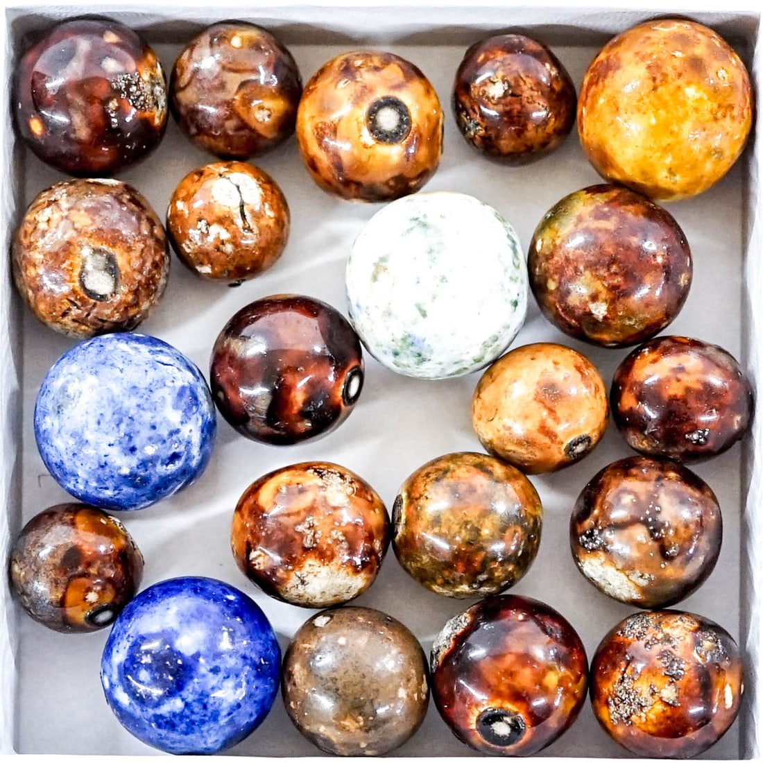 Group of Clay (Bennington) Marbles: Mixed condition. The absence of a condition report does not imply that the lot is in perfect condition or completely free from wear and tear, imperfections, or the conditions of aging. Photos may also