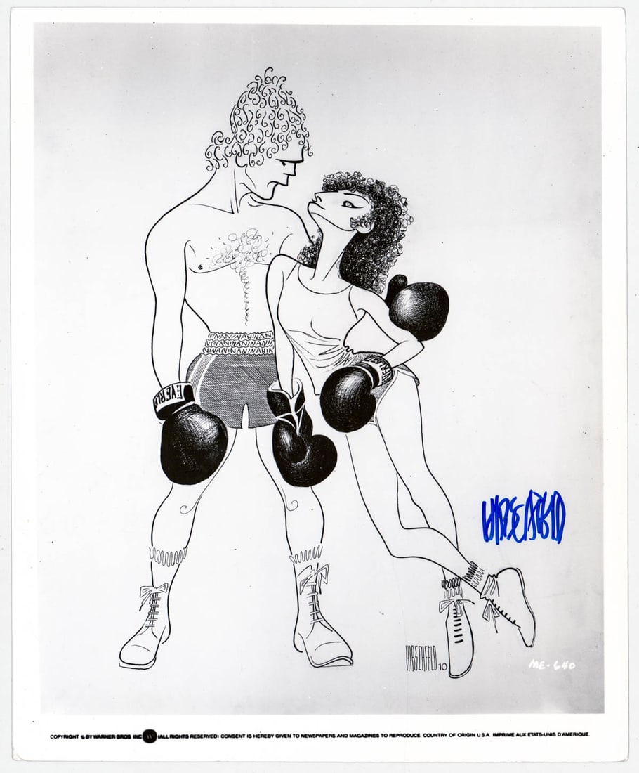 Al Hirschfeld 8x10 Caricature Photo SIGNED COA: Al Hirschfeld signed 8x10 caricature photo of Ryan O'Neal and Barbara Streisand in 'Main Event'. Beckett Authentication Services #BT66394. Lot measures 8.125 x 10 x .125 in. for shipping purposes. The