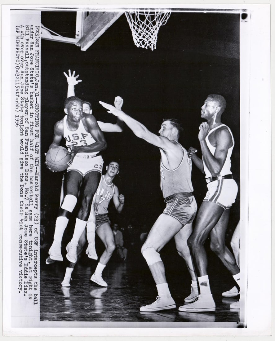 Bill Russell Type III Wire Photo (USF): Bill Russell Type III Wire Photo (USF). Measures 10 x 8.125 inches. VG-EX, one horizontal crease upper left. The absence of a condition report does not imply that the lot is in perfect condition or co