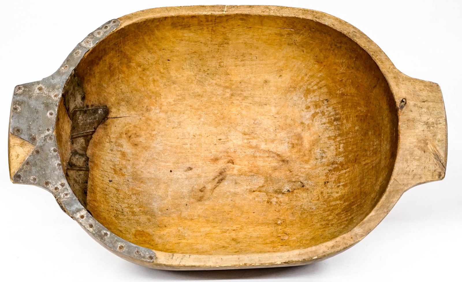 Large Wood Food Bowl with Old Repairs: Measures 15.25 in. across rim x 24 in. across handles x 7 in. high. Lot measures 15.25 x 24 x 7 in. for shipping purposes. The absence of a condition report does not imply that the lot is in perfect c