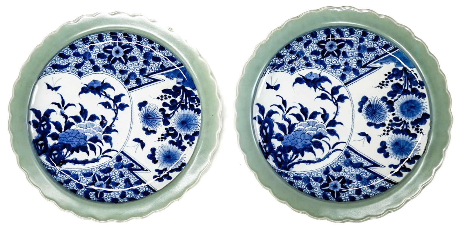 Asian (2) Decorative Platters 15.75IN Diameter: Two (2) platters with green boarders and blue floral motifs. There are several small nicks at edges of scalloped rims. Lot measures 15.75 x 15.75 x 3.75 in. for shipping purposes. The absence of a con