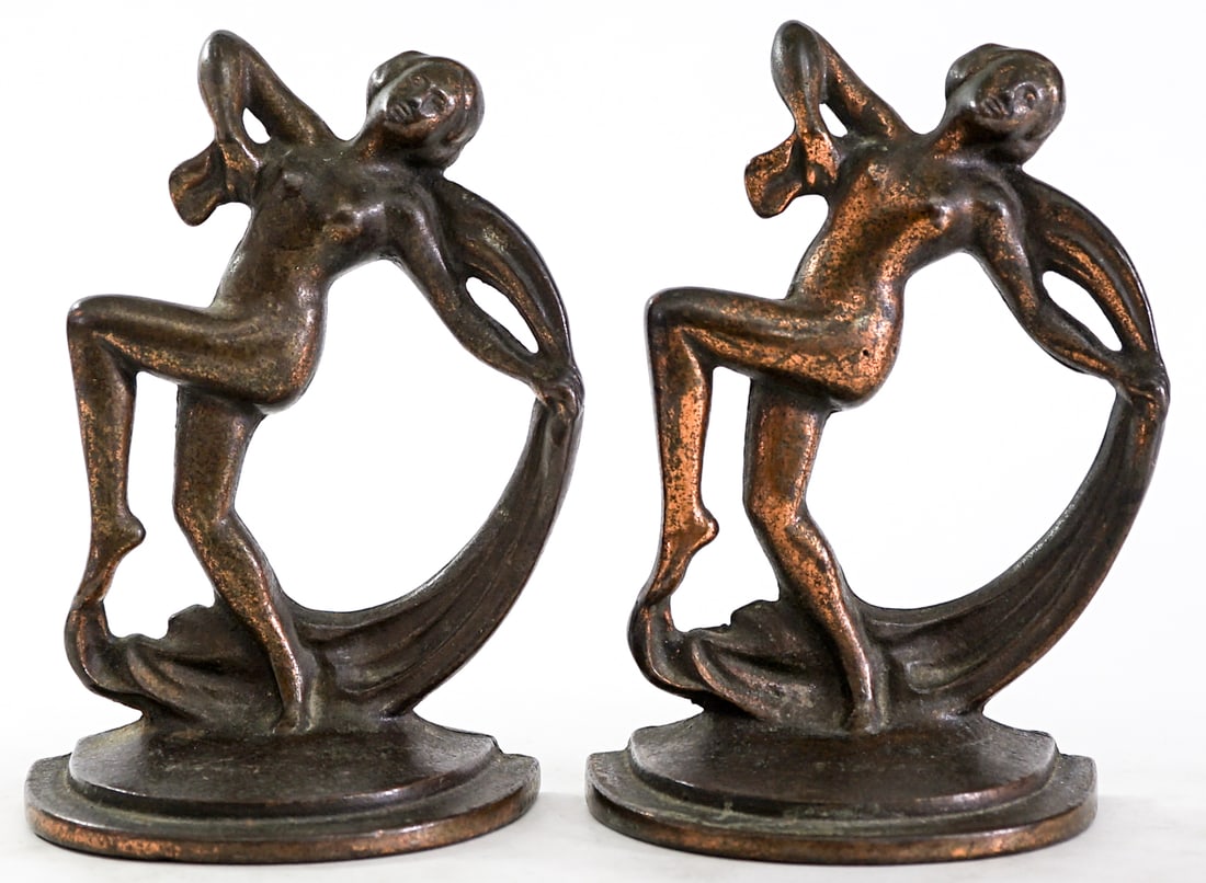 Art Deco Scarf Dancer Pair Cast Iron Bookends: Pair of bookends with foundry mark at base. EACH measures 6.5 x 5 x 2.75 in. Measures 6.5 x 5 x 5.5 inches for shipping purposes. The absence of a condition report does not imply that the lot is in pe