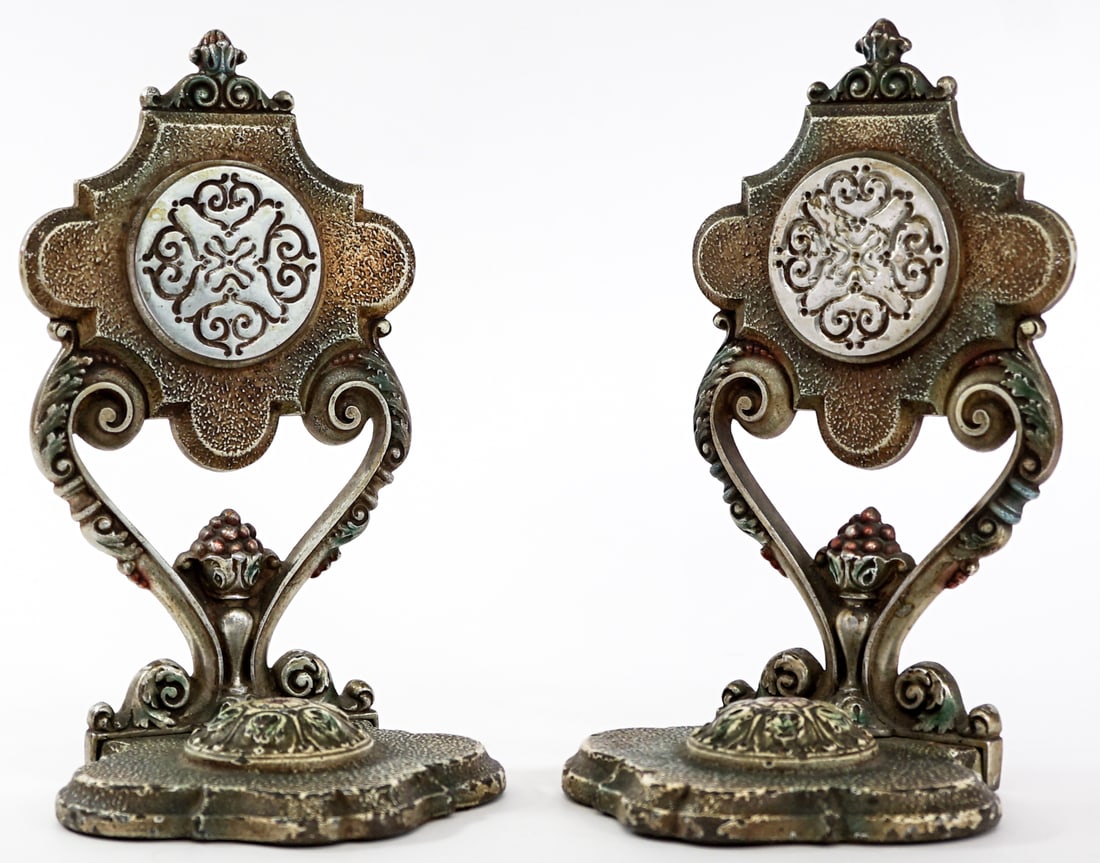 Cast Metal Pair Bookends Victorian Scroll: Pair of cast metal bookends. Victorian Flame and Fruit Scroll. Note one back is loosening from base. EACH measures 8.5x 4.75 x 4.25 in. Measures 8.5 x 4.75.5 x 8.5 inches for shipping purposes. The ab