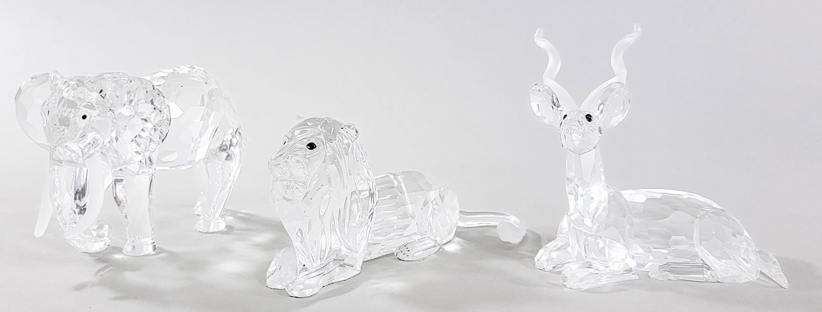 Swarovski Crystal (3).: Swarovski Crystal (3). Includes 1994 the Kudu, 1993 Elephant and 1995 the Lion. No Damage with original boxes. Measures 16 x 14 x 8 in. for shipping purposes only (box size). The absence of a conditio