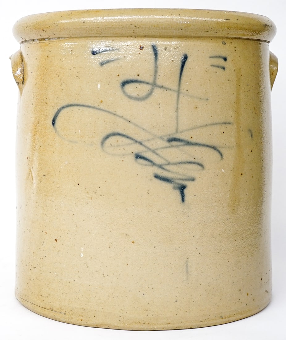 4 Gallon Red Wing Salt Glaze Stoneware: Four gallon Red Wing, circa 1877-1908, salt glaze, side wall mark, Lazy 8 design or Tornado. Measures 11.75 x 11.25 x 11 inches. There is one inside rim chip. No cracks. The absence of a condition rep