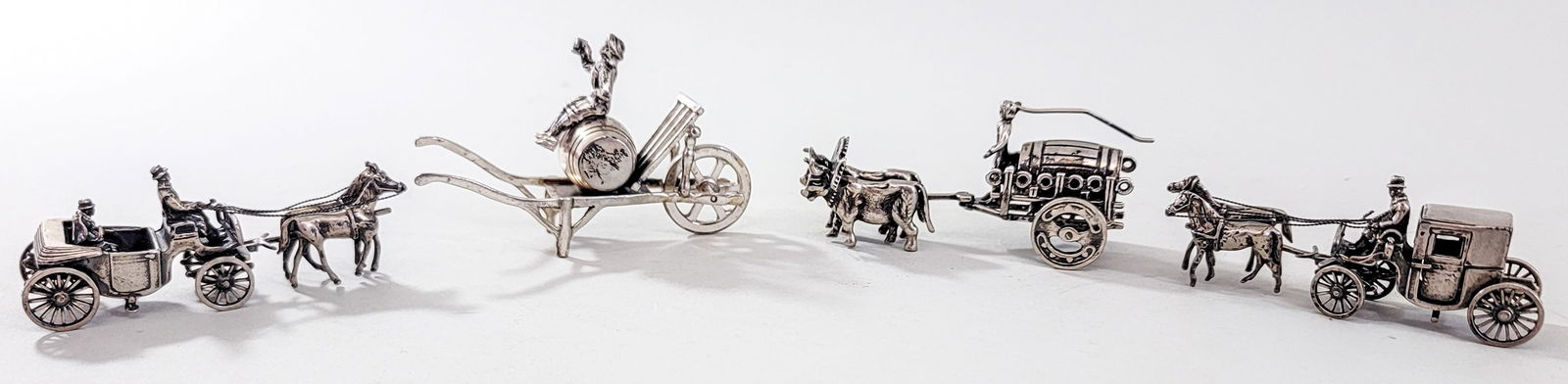 Dutch Silver (4) Miniatures 192g: Four (4) Dutch Silver .833 miniatures (all hallmarked) weigh 192 grams and measure 3 in. to 3.5 in. long. Measures 4 x 5 x 2.25 in. for shipping purposes only. The absence of a condition report does n