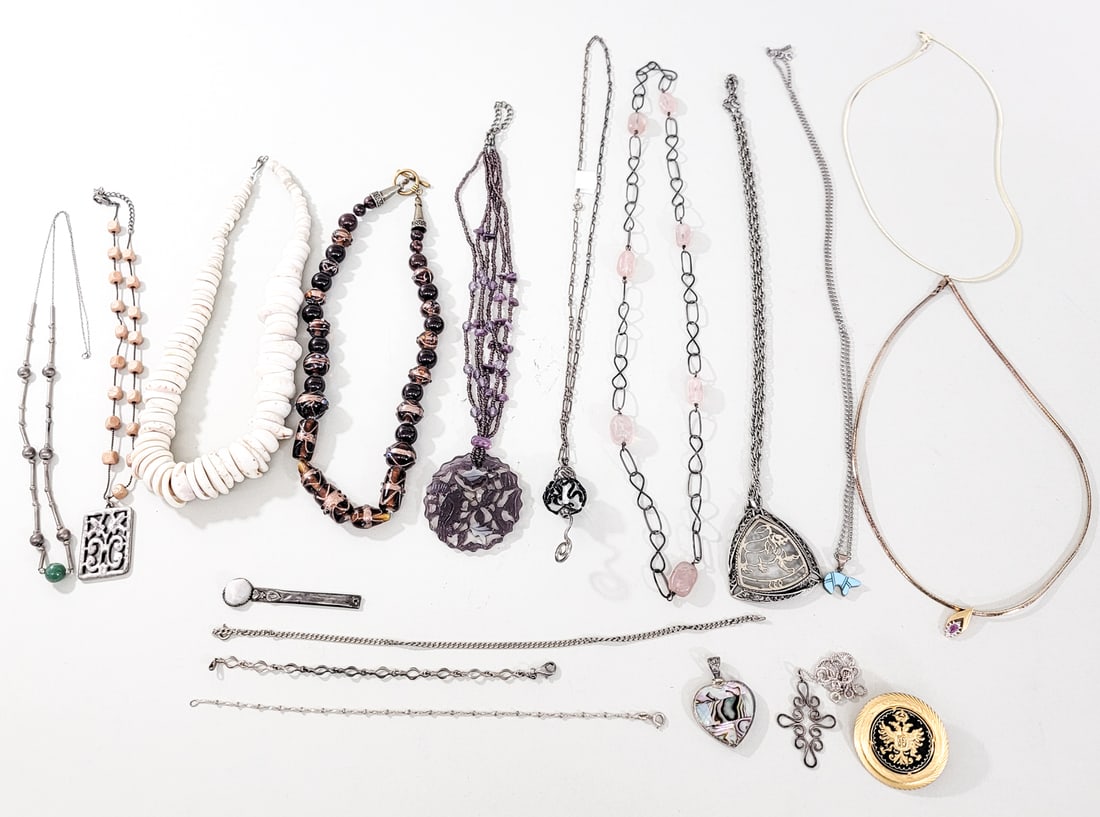 Beaded, Shells, Turquoise and Metalware Jewelry: Assortment of nineteen (19) metalware necklaces, chains, pins and pendants. No evident cracks, chips or repairs. Measures 5 x 4 x 4 in. for shipping purposes only. The absence of a condition report do