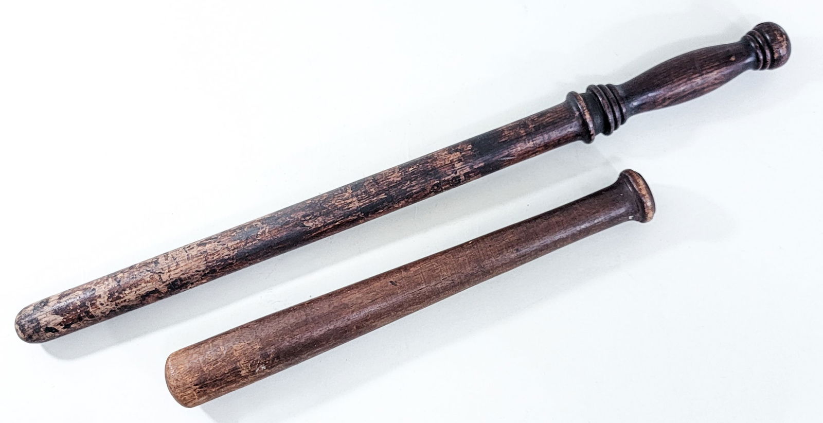 Wood (2) Fish Bats: Measure 13.5 and 22 in. long. Lot measures 22 x 3 x 2 in. for shipping purposes only. The absence of a condition report does not imply that the lot is in perfect condition or completely free from wear