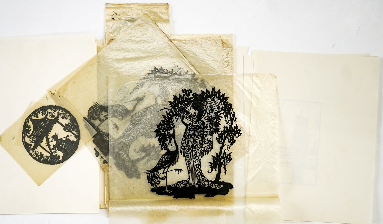 Chinese Paper Cutting Silhouettes (NOS): Chinese Paper Cutting Silhouettes (NOS, New Old Stock) from William Greenbaum Fine Prints (48 pieces). They measure 4 inches diameter to 6.75 x 9 inches. Lot measures 14 x 12 x .5inches for shipping