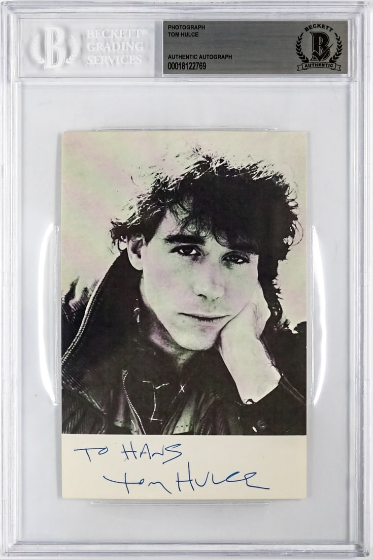 Tom Hulce Signed Photo: Measures 6 x 4 inches. Excellent condition. Authenticated and Encapsulated by Beckett Authentication Services. The absence of a condition report does not imply that the lot is in perfect condition or