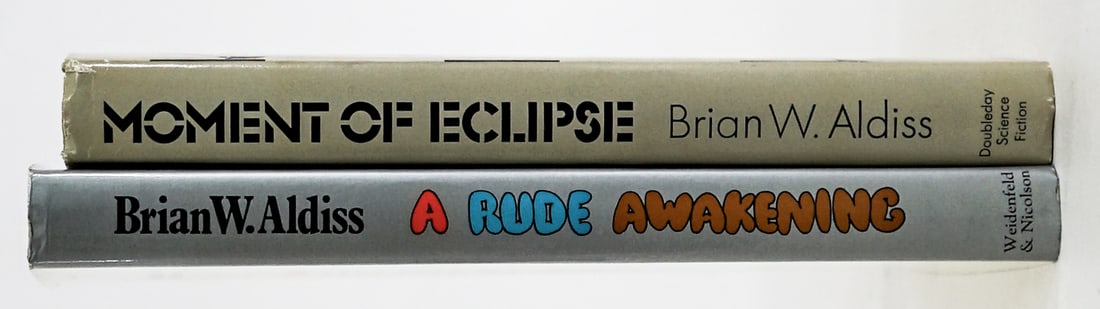 Brian W. Aldiss (2) 1 SIGNED [Sci-Fi]: 1) A Rude Awakening, Horatio Stubbs Novel by Brian W. Aldiss. Signed on title page. Weidenfeld and Nicolson, London 1978 1st UK with unclipped dust jacket. 206 pp. Blue covers. 2) Moment of Eclipse,