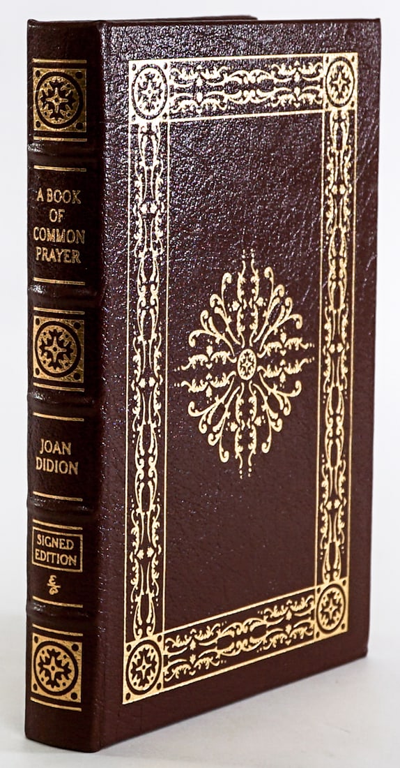 Book of Common Prayer - Didion SIGNED 2002 Easton: A Book of Common Prayer by Joan Didion. Leatherbound Collector's Edition Easton Press 2002 with COA tucked in. SIGNED. 272 pp. Gilt cover design with gilt page surround. 5 raised bands on spine. Silk-