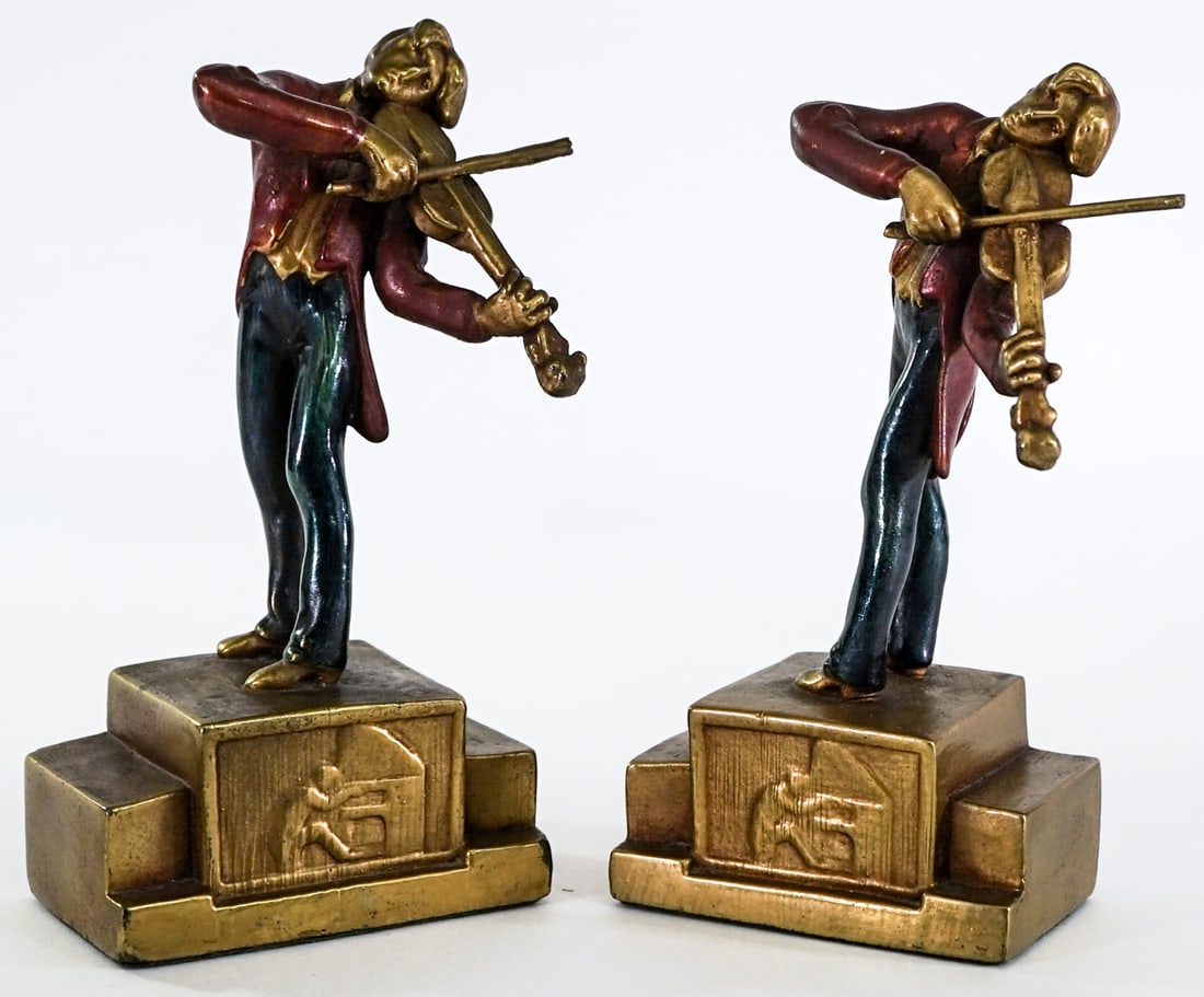 Armor Bronze Clad (Pair) Vintage Bookends -Violin: Pair of Armor Bronze (Violinist) bookends. EACH measures 7 x 3.75 x 2.5 in. Lot measures 7 x 3.75 x 5.5 inches for shipping purposes. The absence of a condition report does not imply that the lot is i