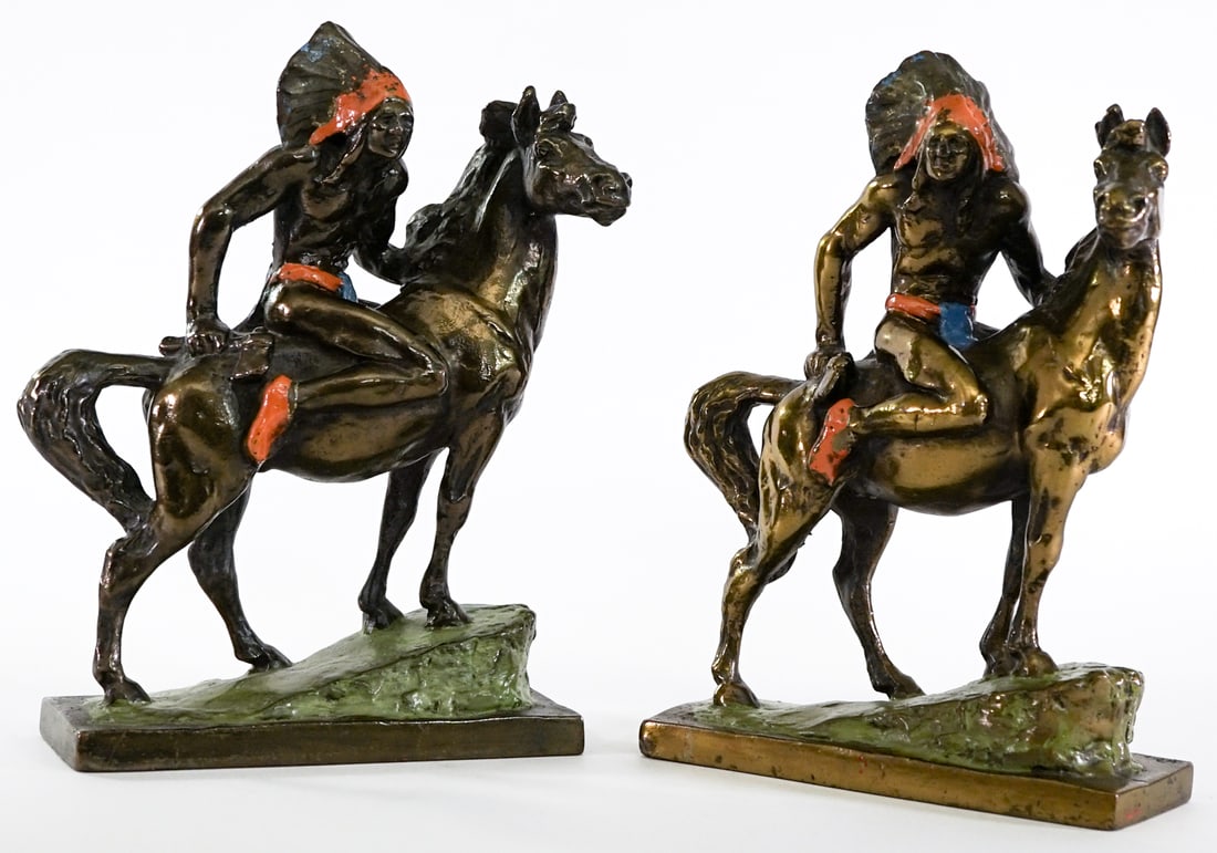 Paul Herzel (Pair) Native American Rider Bookends: Paul Herzel bronze clad - cold painted Native American with Horse bookends. EACH measures 8.5 x 7 x 3 in. Lot measures 8.5 x 7 x 6 inches for shipping purposes. The absence of a condition report does