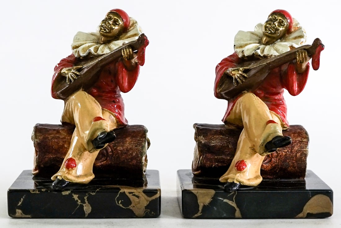 Pierrot French Clown (Pair) Bronze Clad Bookends: Art Deco Pierrot French Clown (pair) bookends. EACH measures 5.5 x 3.875 x 4 in. Lot measures 5.5 x 3.875 x 8 inches for shipping purposes. The absence of a condition report does not imply that the lo
