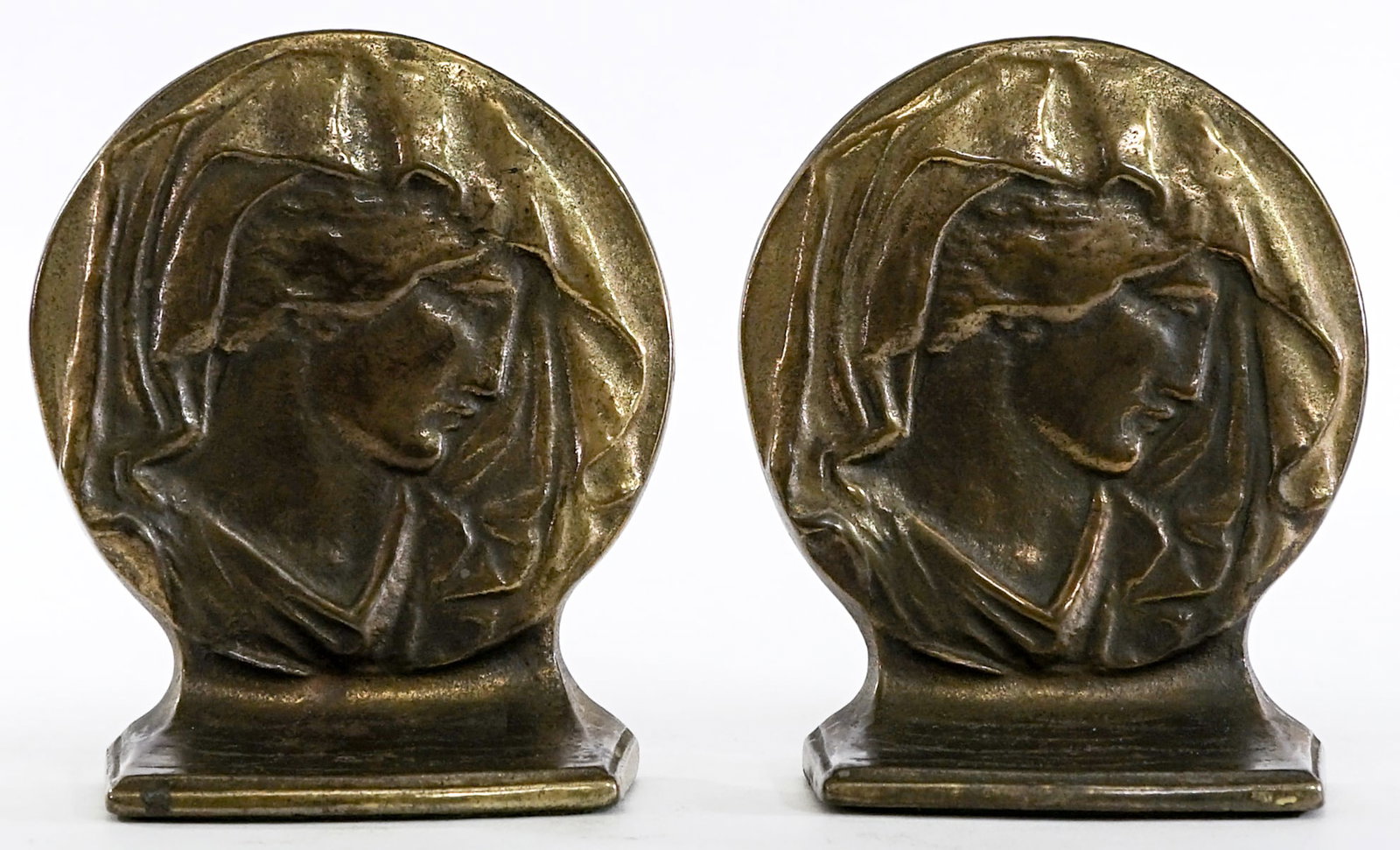 Vintage Brass (Pair) Bookends [Veiled Mary]: Vintage pair of bookends. EACH measures 6.125 x 5.25 x 2.25 in. Lot measures 6.125 x 5.25 x 4.5 inches for shipping purposes. The absence of a condition report does not imply that the lot is in perfec