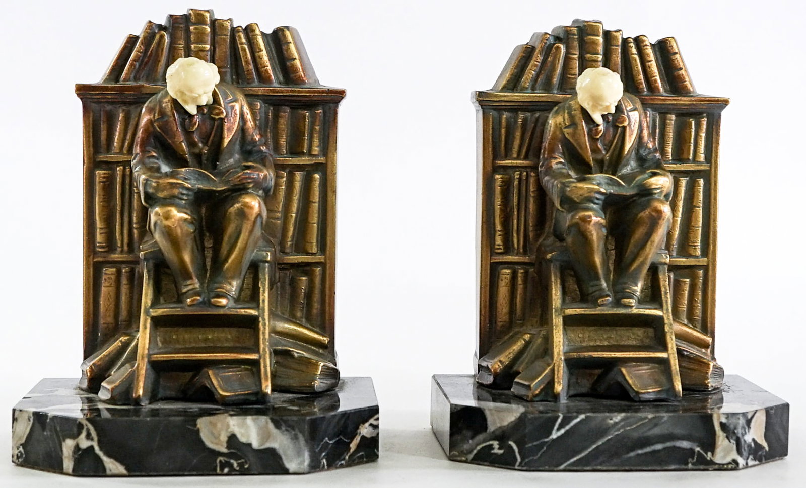 Scholar / Library (Pair) Cast Metal Bookends: Pair bookends gilted with polymer heads and marble stands. EACH measures 6.5 x 5 x 4.5 in. Lot measures 6.5 x 5 x 9 inches for shipping purposes. The absence of a condition report does not imply that