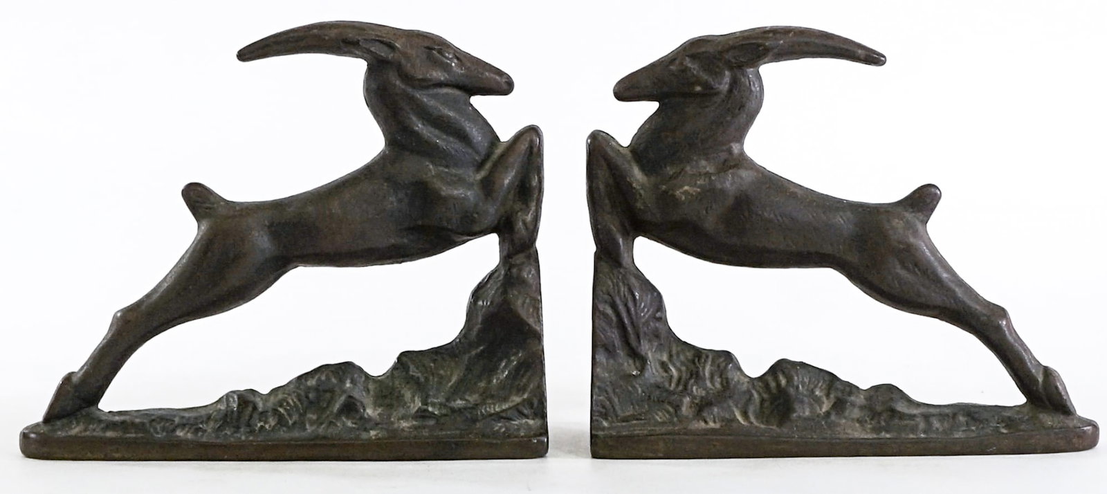 Leaping Gazelle Art Deco (Pair) Bookends: Cast Iron Art Deco leaping gazelle / antelope pair bookends. EACH measures 5 x 2.5 x 6 in. Lot measures 5 x 5 x 6 inches for shipping purposes. The absence of a condition report does not imply that th