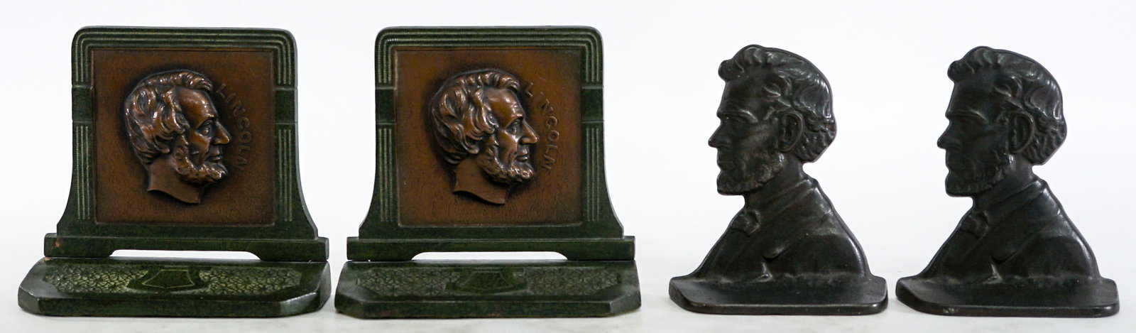 Abraham Lincoln (2 Pair) Bookends: 1) Judd Co. 8747 cast metal cold-painted measures 5.625 x 6 x 2.25 in. 2) #906 cast iron measures 5.375 x 4.5 x 1.75 in. Lot measures 5.625 x 4.5 x 8 inches for shipping purposes. The absence of a con