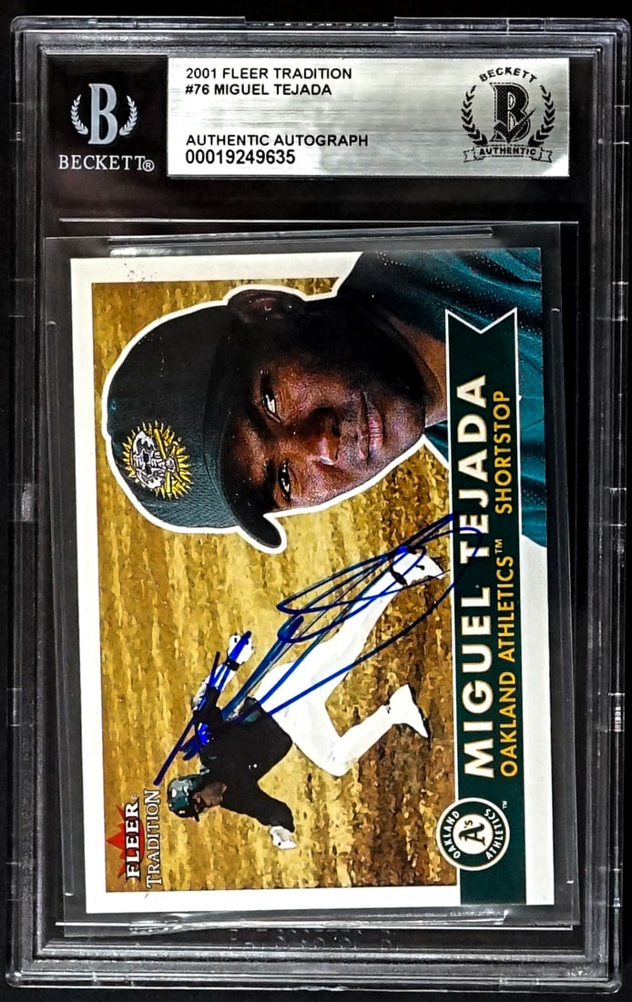 Miguel Tejada On Card SIGNED 2001 Fleer #76: Lot measures 5.5 x 3.5 x .25 inches for shipping purposes. The absence of a condition report does not imply that the lot is in perfect condition or completely free from wear and tear, imperfections, o
