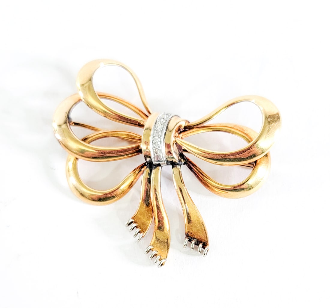18k Gold (Stamped 750) & Diamond Brooch: Weighs 18.71 grams. Very good condition. Measures 2.125 x 2 x 2 inches. The absence of a condition report does not imply that the lot is in perfect condition or completely free from wear and tear, imp