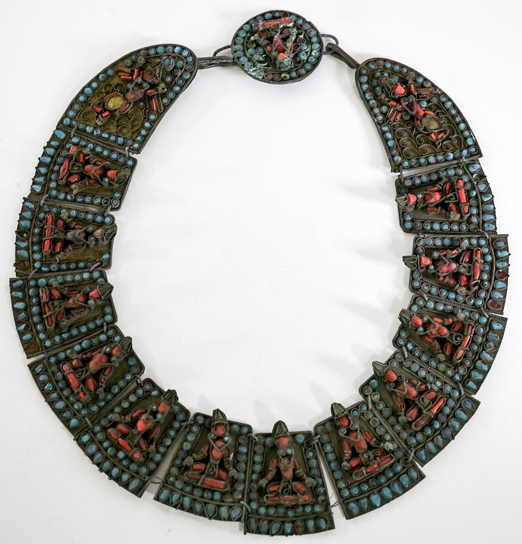 Tibetan Coral and Turquoise Buddhist Necklace: Tibetan coral and turquoise Buddhist necklace / collar. Measures Lot measures 10.75 in. H x 10 in. W x 1.5 in. D for shipping purposes only. The absence of a condition report does not imply that the l