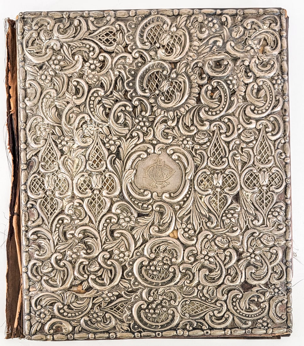 Sterling and Leather Manuscript Cover: Dominick and Haff, NY. Late 19th century manuscript / book cover. Elaborate pierced decoration. Measures 13 x 16 x 1 in. Lot measures 16 in. H x 13 in. W x 1 in. D for shipping purposes only. The